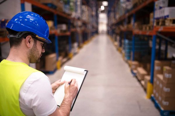 factory-worker-holding-clipboard-checking-inventory-warehouse-storage-department.jpg